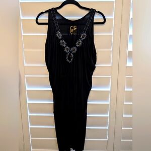 Black embellished V-neck dress, loose on top, tight on bottom